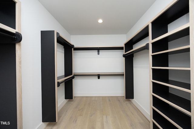 spacious closet featuring light hardwood / wood-style floors