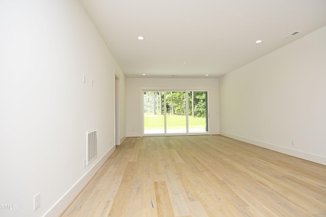 spare room with light wood-type flooring