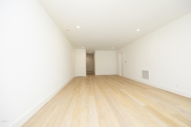 unfurnished room with light hardwood / wood-style floors