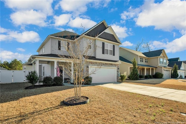 view of front of property featuring a garage and a front yard