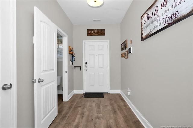 doorway to outside featuring wood-type flooring