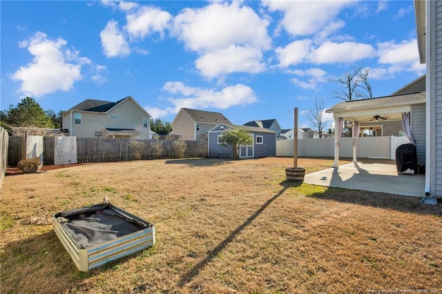 view of yard featuring an outdoor structure, a patio, and ceiling fan