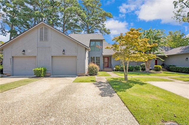 view of front of property with a garage and a front yard