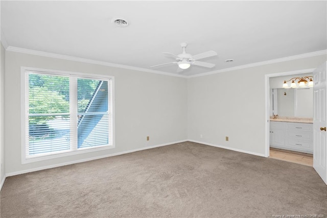 unfurnished room featuring crown molding, ceiling fan, and light carpet