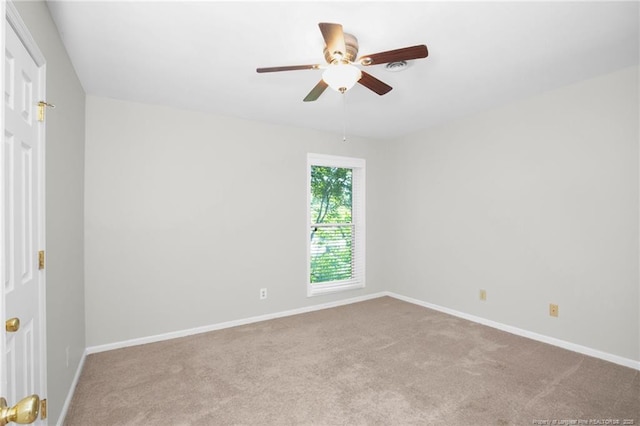 empty room with light carpet and ceiling fan