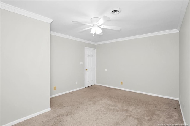 carpeted empty room featuring crown molding and ceiling fan