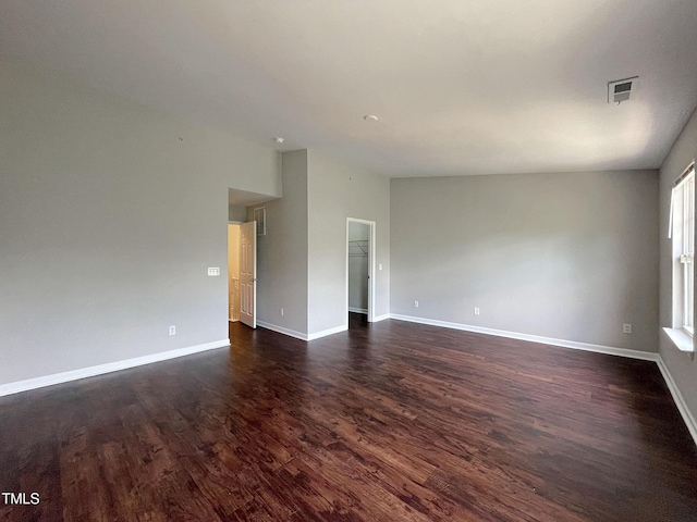unfurnished room featuring dark hardwood / wood-style flooring