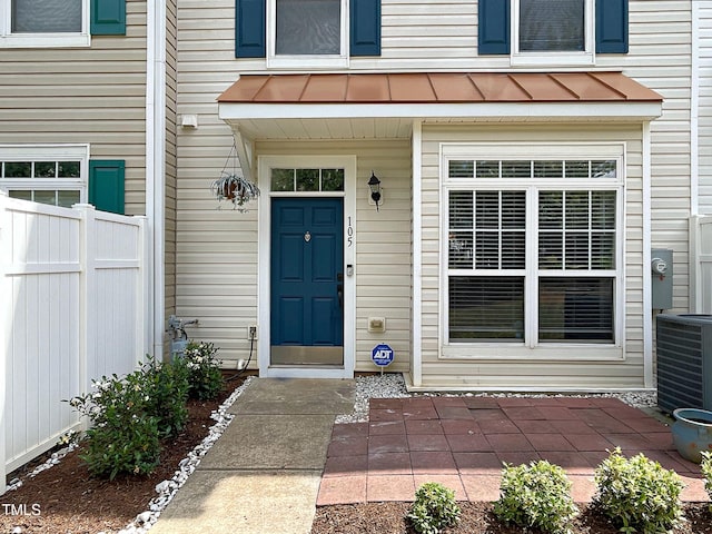 doorway to property featuring central AC unit