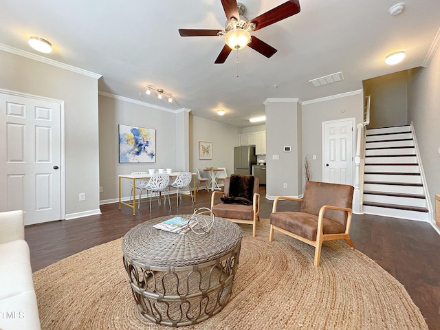 living room featuring ornamental molding, ceiling fan, and dark hardwood / wood-style flooring