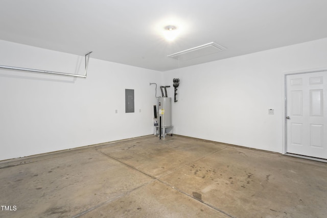 garage featuring electric panel and electric water heater