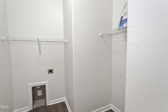 laundry room with electric dryer hookup and hardwood / wood-style floors