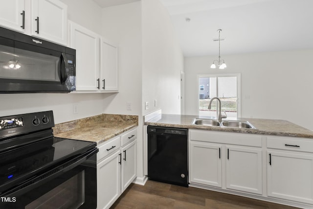 kitchen with pendant lighting, sink, black appliances, white cabinets, and dark hardwood / wood-style flooring