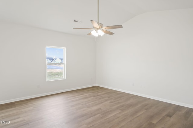 unfurnished room featuring ceiling fan, lofted ceiling, and light wood-type flooring