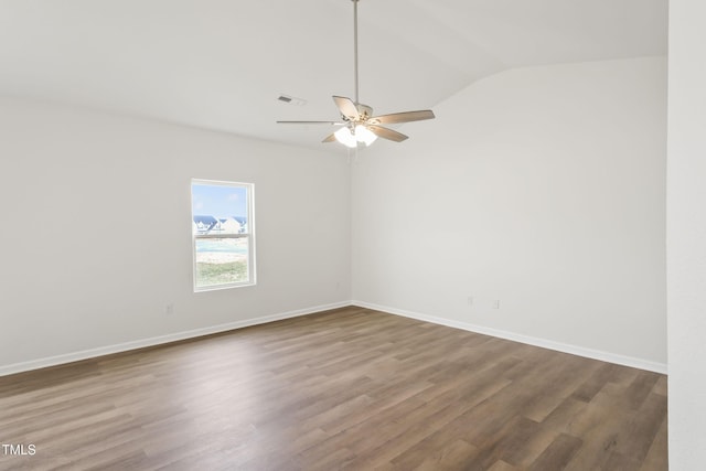 unfurnished room with lofted ceiling, wood-type flooring, and ceiling fan