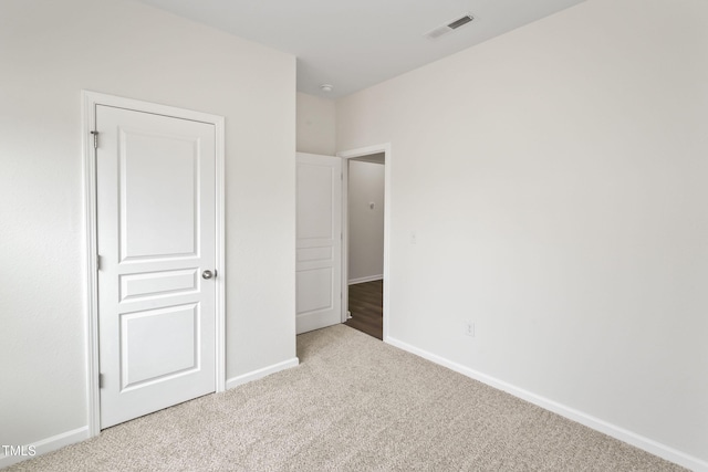 unfurnished bedroom featuring carpet