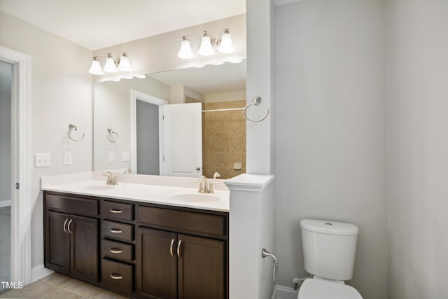 bathroom with vanity, tile patterned floors, and toilet