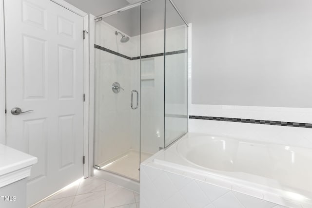 bathroom with independent shower and bath