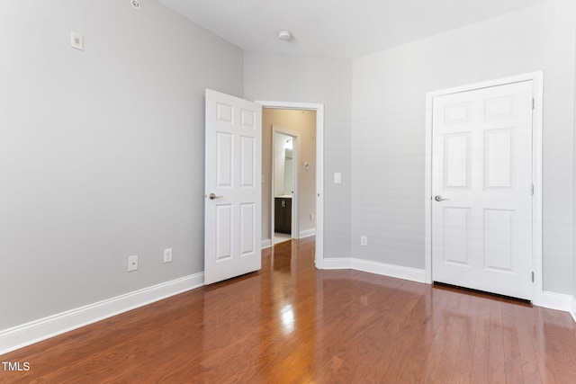 unfurnished bedroom featuring hardwood / wood-style floors