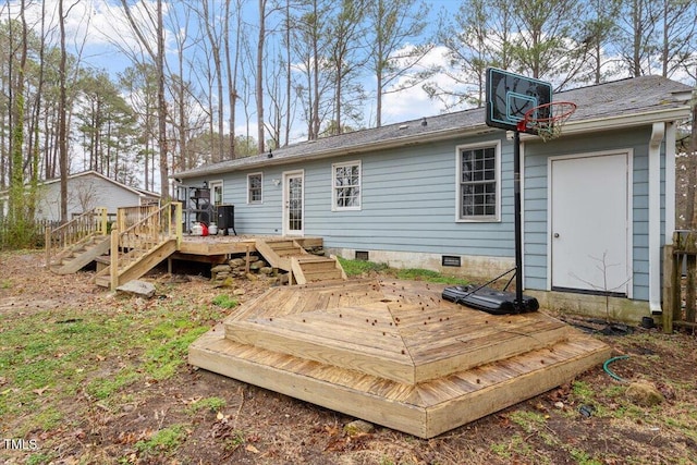 rear view of house with crawl space and a deck