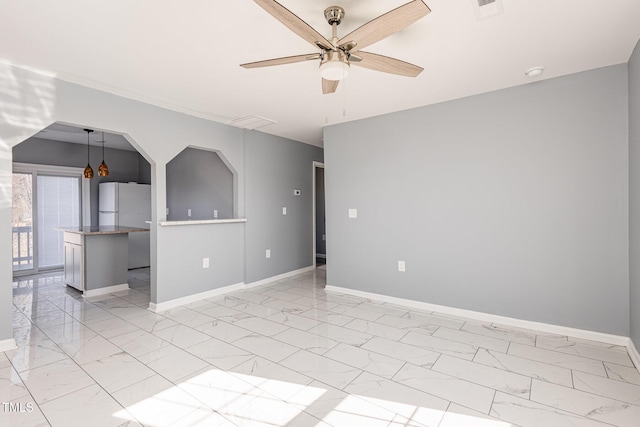 spare room featuring ceiling fan