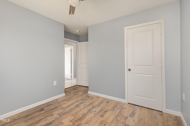 unfurnished bedroom featuring light hardwood / wood-style floors and ceiling fan