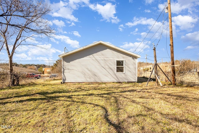 view of property exterior with a lawn