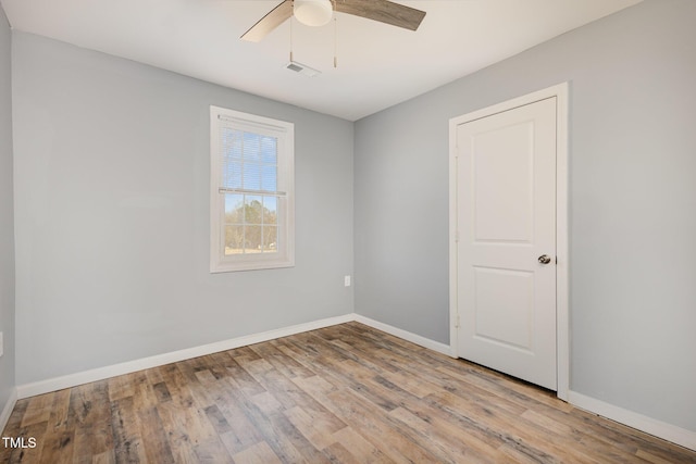 unfurnished room featuring ceiling fan and light hardwood / wood-style floors