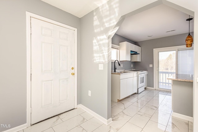 kitchen with sink, hanging light fixtures, electric range, light stone countertops, and white cabinets