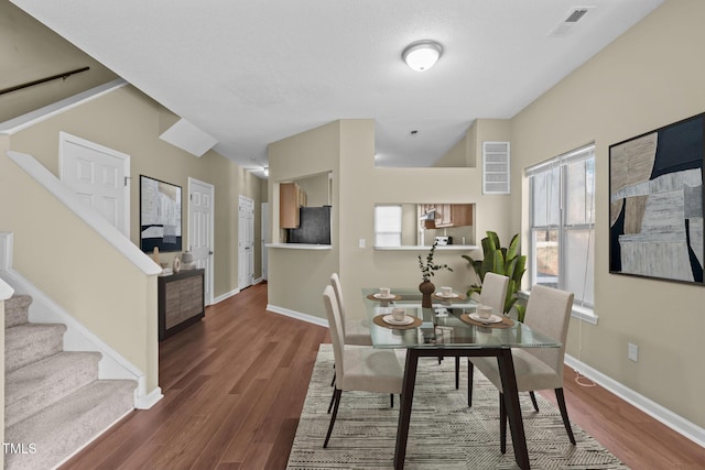 dining area with dark wood-type flooring