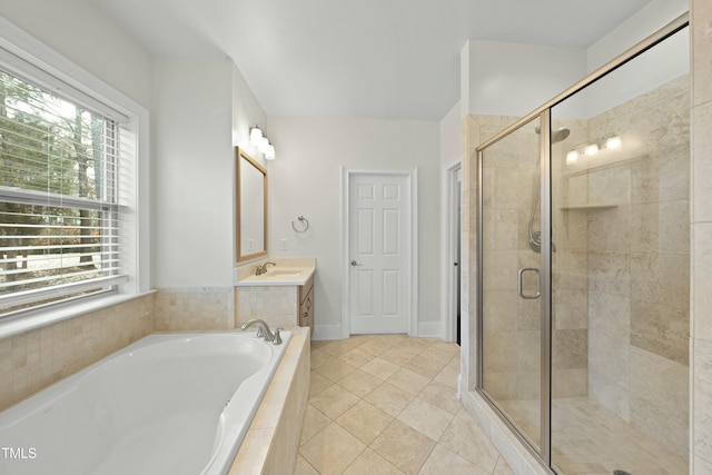 bathroom featuring tile patterned flooring, vanity, and plus walk in shower