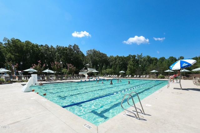 view of swimming pool with a patio area