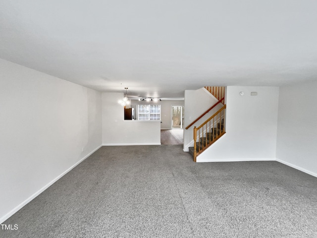 unfurnished living room featuring carpet floors