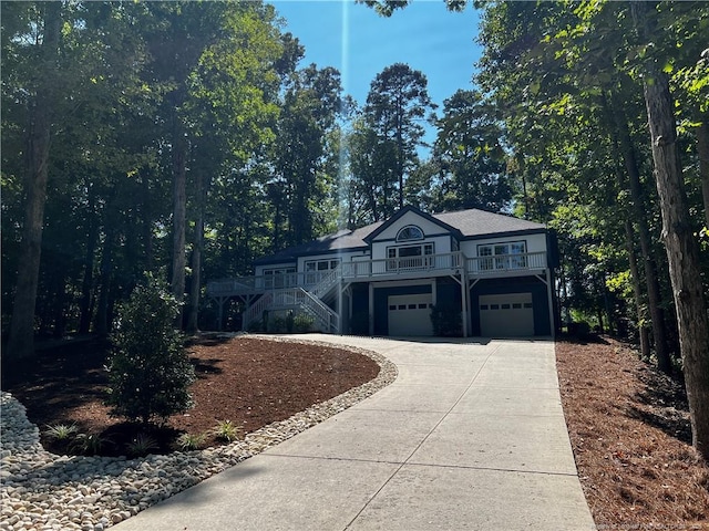 view of front of home featuring a wooden deck and a garage