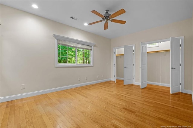 unfurnished bedroom featuring ceiling fan and light wood-type flooring