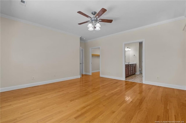 unfurnished room featuring ornamental molding, ceiling fan, and light hardwood / wood-style floors