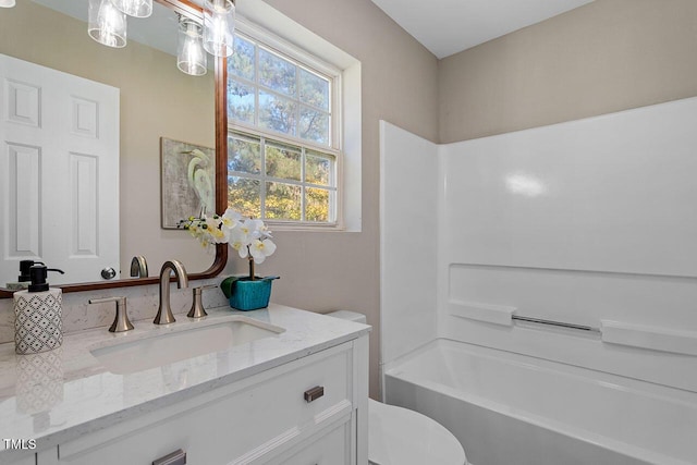 full bathroom with vanity, toilet, and shower / washtub combination