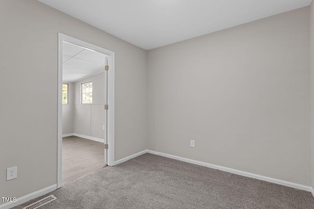 spare room featuring carpet floors