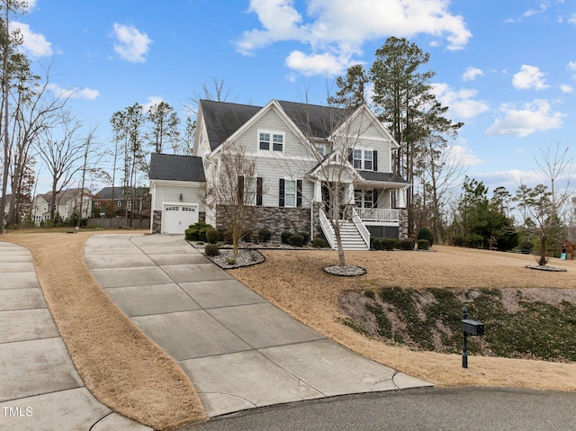 view of front of home featuring a garage and a porch