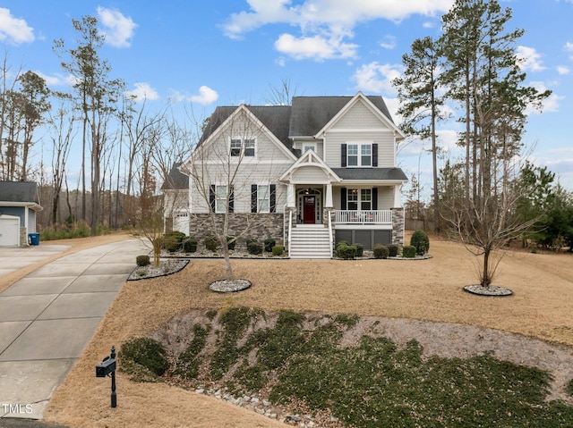 craftsman-style home with a porch and a garage