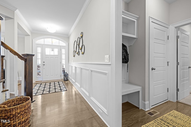 interior space featuring ornamental molding and wood-type flooring