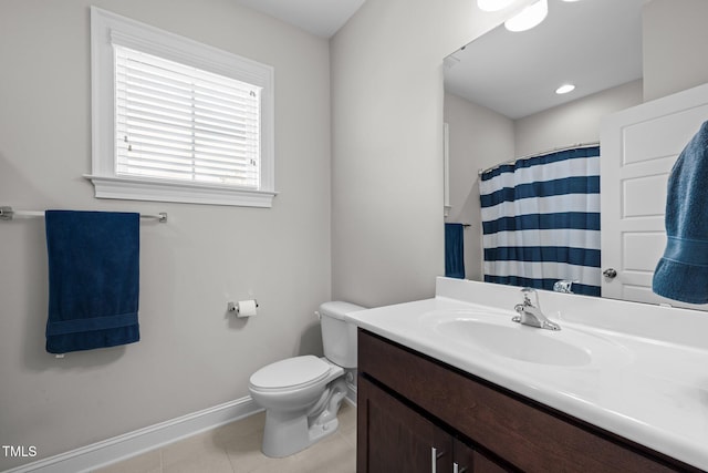 bathroom with a shower with curtain, vanity, toilet, and tile patterned flooring