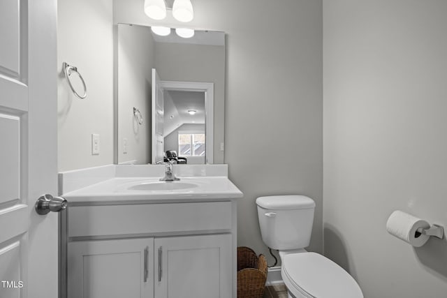 bathroom with vanity and toilet