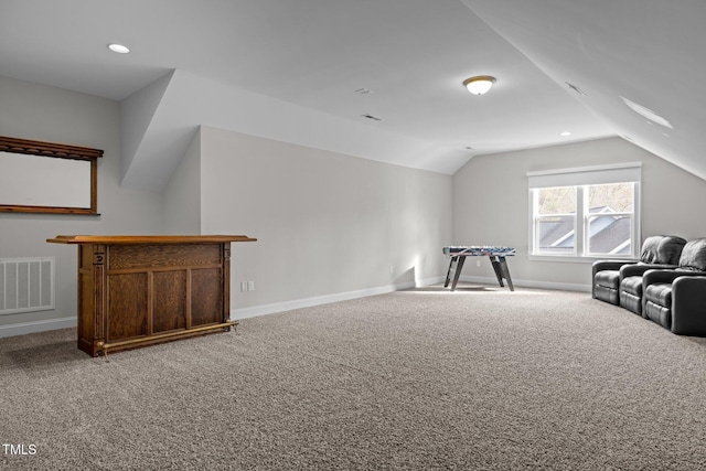 additional living space featuring vaulted ceiling and carpet