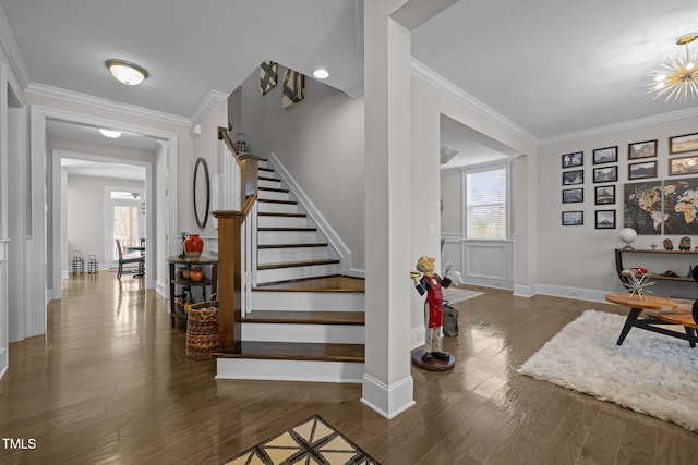 stairway featuring crown molding and hardwood / wood-style floors