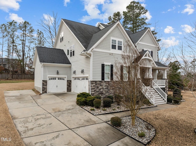 view of front of home with a porch and a garage