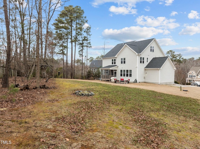 exterior space with a patio and a lawn