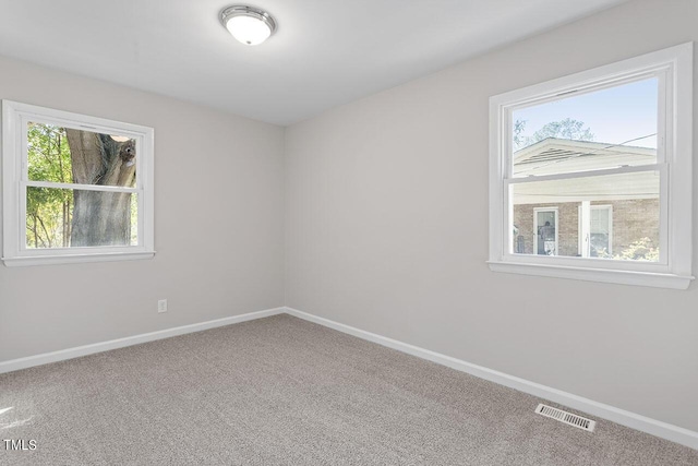 empty room with carpet flooring