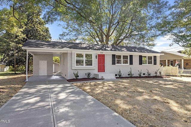 ranch-style home with a carport