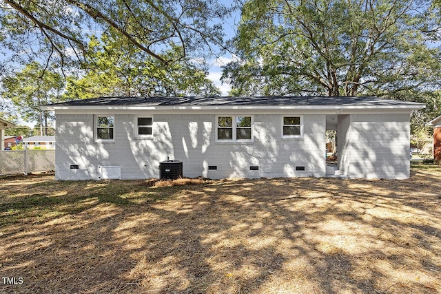 rear view of house featuring central AC unit