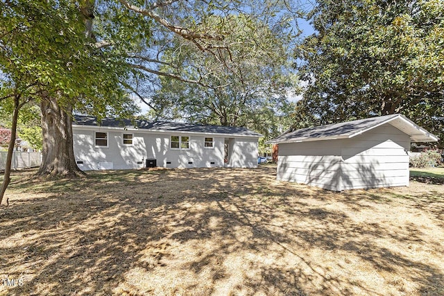 view of front of house featuring a storage shed